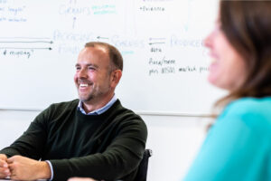 David Honcoop smiling at a conference table